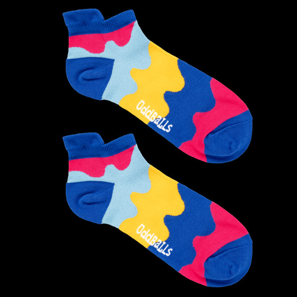 Colorful socks with a pattern and OddBalls branding on a white background